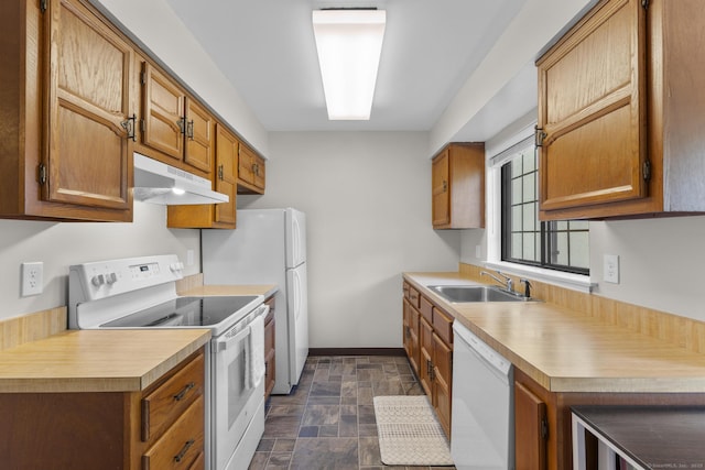 442 Swanson Cres Unit 442, Milford, CT 06461 - kitchen featuring white appliances, under cabinet range hood, a sink, stone finish floors, and light countertops