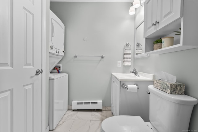442 Swanson Cres Unit 442, Milford, CT 06461 - half bath with a baseboard radiator, estacked washer and dryer, toilet, marble finish floors, and vanity