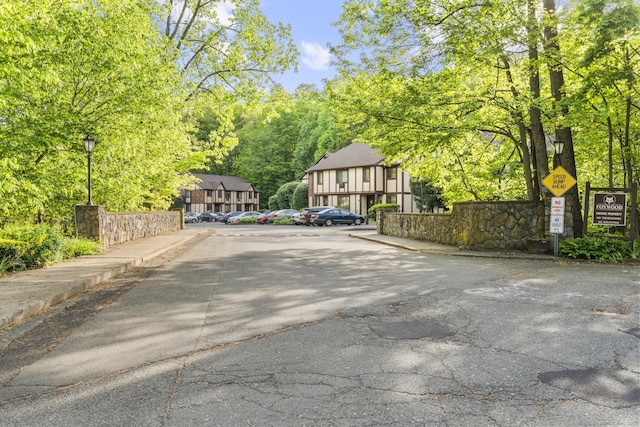442 Swanson Cres Unit 442, Milford, CT 06461 - view of asphalt street featuring street lighting, curbs, traffic signs, and sidewalks