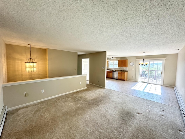 26 John George Dr, Meriden, CT 06450 - unfurnished living room with light colored carpet, a chandelier, a textured ceiling, baseboards, and baseboard heating