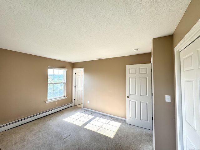 26 John George Dr, Meriden, CT 06450 - unfurnished room featuring a baseboard radiator, carpet flooring, and a textured ceiling