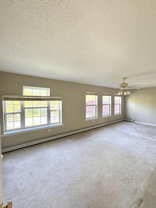 26 John George Dr, Meriden, CT 06450 - unfurnished room with a textured ceiling, carpet flooring, baseboard heating, and ceiling fan