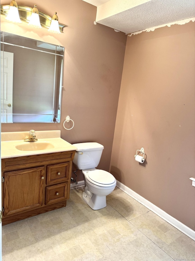 26 John George Dr, Meriden, CT 06450 - bathroom featuring toilet, baseboards, vanity, and a textured ceiling