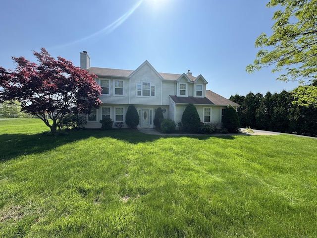 26 John George Dr, Meriden, CT 06450 - view of front of home featuring a front lawn and a chimney