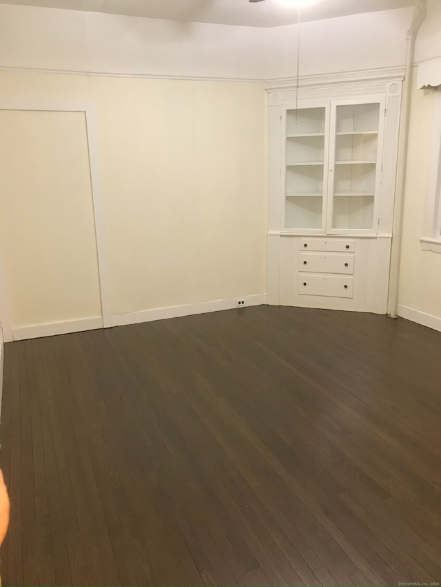 61 Williams St, Norwich, CT 06360 - spare room featuring dark wood-style floors and baseboards