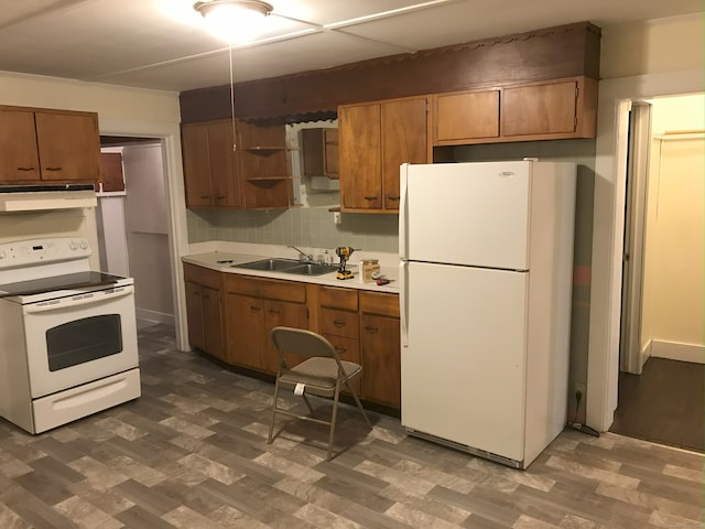 61 Williams St, Norwich, CT 06360 - kitchen with white appliances, a sink, under cabinet range hood, and wood finished floors