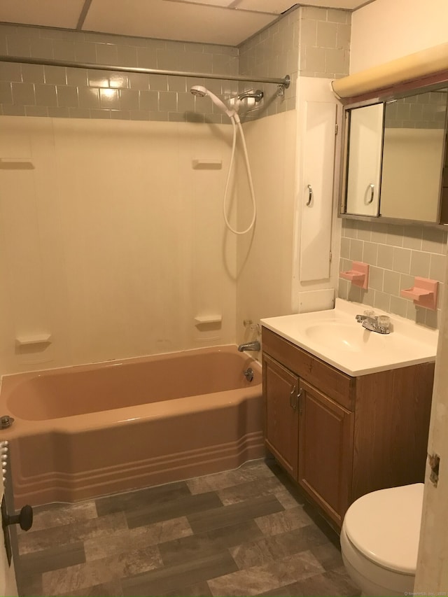 61 Williams St, Norwich, CT 06360 - bathroom with toilet, shower / bath combination, vanity, wood finished floors, and decorative backsplash