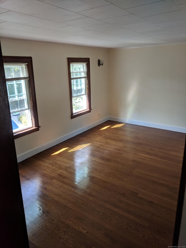 61 Williams St, Norwich, CT 06360 - spare room featuring dark wood-type flooring and baseboards
