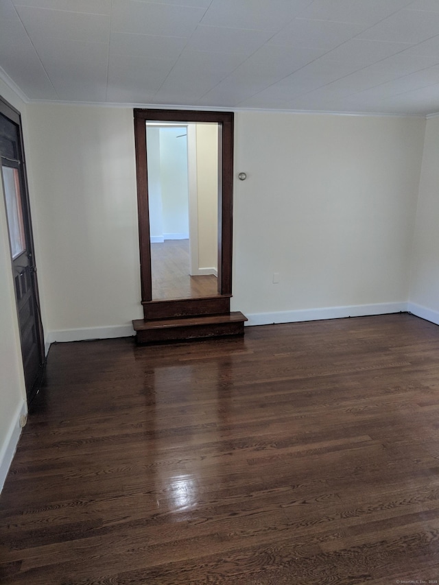 61 Williams St, Norwich, CT 06360 - empty room featuring crown molding, dark wood-style floors, and baseboards