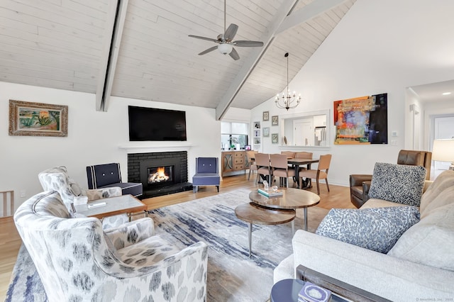 635 N Trl Unit A, Stratford, CT 06614 - living area featuring wood finished floors, beamed ceiling, a fireplace, ceiling fan, and a chandelier