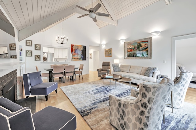 635 N Trl Unit A, Stratford, CT 06614 - living area featuring a chandelier, light wood-style floors, a ceiling fan, beamed ceiling, and wooden ceiling