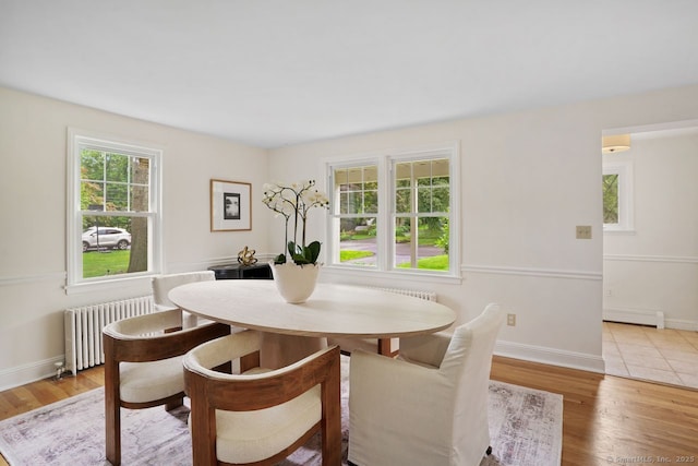8 Bailey St, Trumbull, CT 06611 - dining space with radiator heating unit, a baseboard radiator, and light wood-type flooring