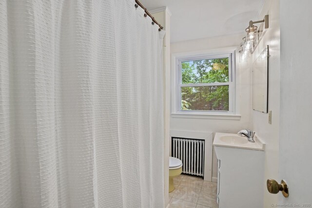 8 Bailey St, Trumbull, CT 06611 - full bath with radiator heating unit, vanity, and tile patterned flooring