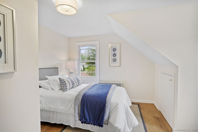 8 Bailey St, Trumbull, CT 06611 - bedroom with wood finished floors and radiator
