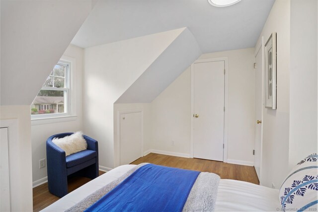 8 Bailey St, Trumbull, CT 06611 - bedroom featuring wood finished floors and vaulted ceiling