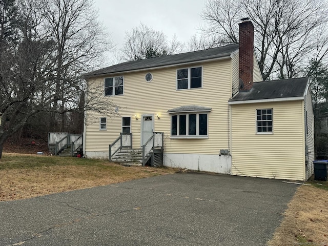 26 Pequonnock Rd, Trumbull, CT 06611 - colonial inspired home featuring a chimney and driveway