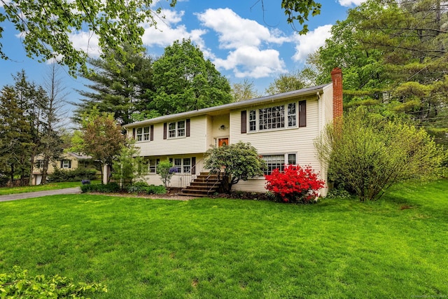 1 Meadowview Ln, Bloomfield, CT 06002 - raised ranch featuring a chimney, stairway, and a front lawn