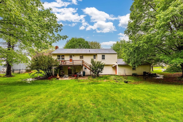 1 Meadowview Ln, Bloomfield, CT 06002 - back of house featuring stairs, a wooden deck, a lawn, and a chimney