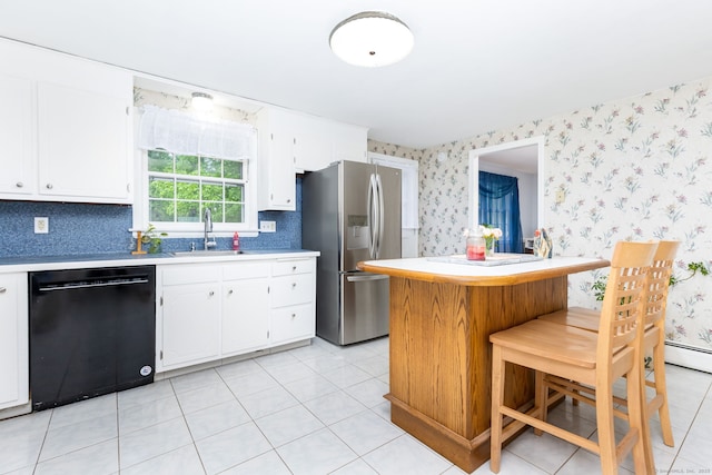 1 Meadowview Ln, Bloomfield, CT 06002 - kitchen with black dishwasher, a sink, stainless steel fridge, wallpapered walls, and light countertops