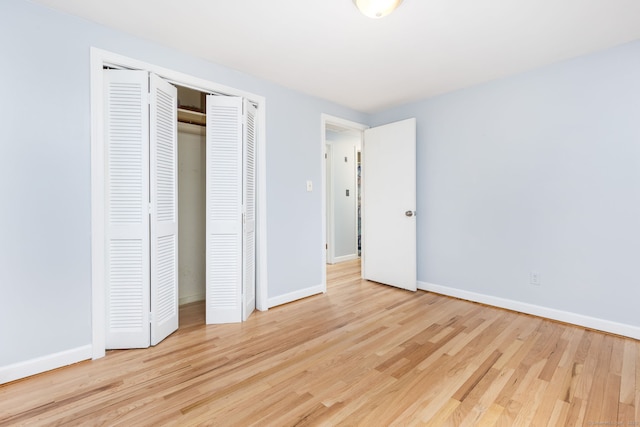 1 Meadowview Ln, Bloomfield, CT 06002 - unfurnished bedroom with wood finished floors, baseboards, and a closet