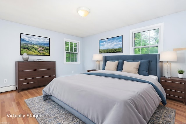 1 Meadowview Ln, Bloomfield, CT 06002 - bedroom with light wood-style flooring and a baseboard radiator