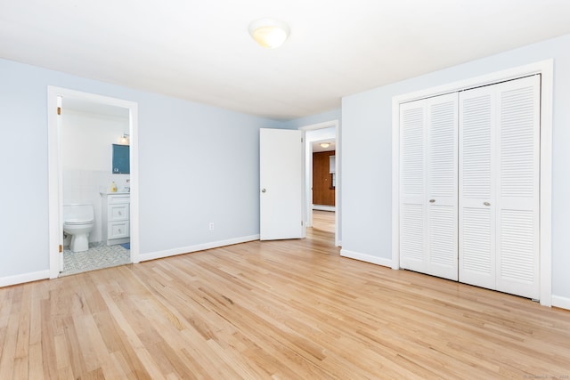 1 Meadowview Ln, Bloomfield, CT 06002 - unfurnished bedroom featuring wood finished floors, a closet, ensuite bath, and baseboards