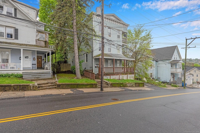 townhome / multi-family property with a porch