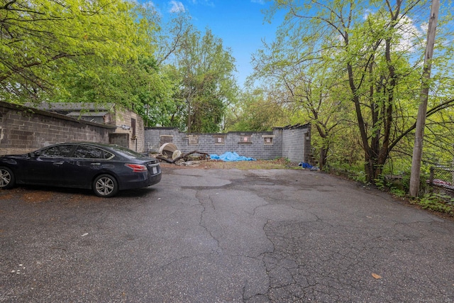 view of car parking with fence