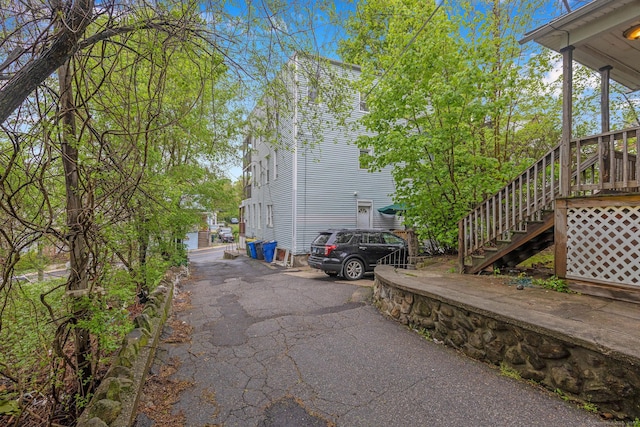 view of property exterior featuring stairway