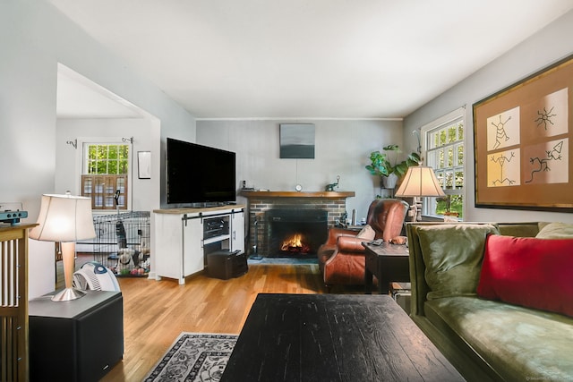 13 Bayberry Ln, Redding, CT 06896 - living room featuring plenty of natural light, a fireplace, and wood finished floors