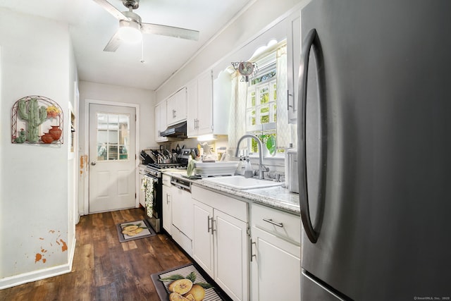 13 Bayberry Ln, Redding, CT 06896 - kitchen with stainless steel appliances, a sink, under cabinet range hood, dark wood finished floors, and white cabinetry