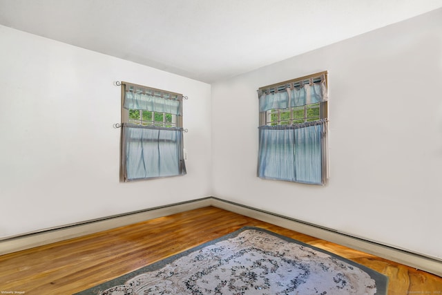 13 Bayberry Ln, Redding, CT 06896 - spare room with wood finished floors and a baseboard radiator