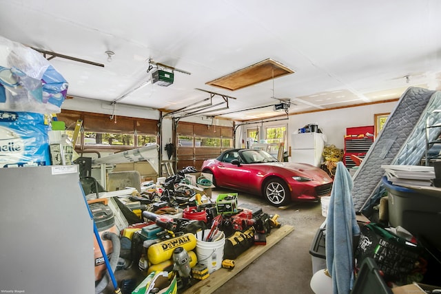13 Bayberry Ln, Redding, CT 06896 - garage with a garage door opener and freestanding refrigerator