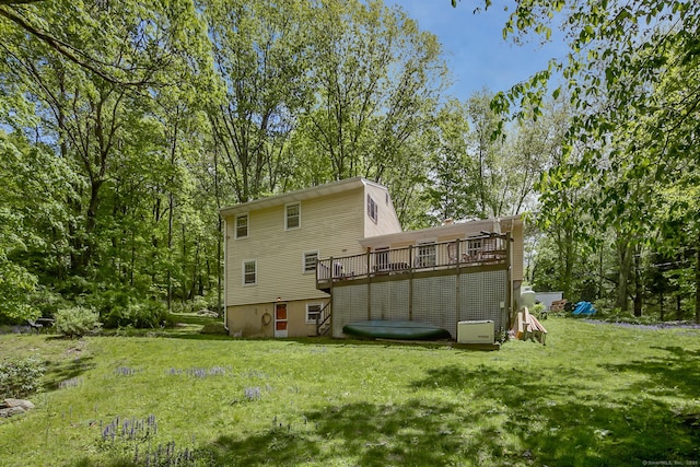 13 Bayberry Ln, Redding, CT 06896 - back of property featuring a lawn, a wooden deck, and view of scattered trees