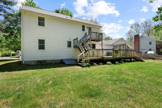 rear view of house with a deck and stairway