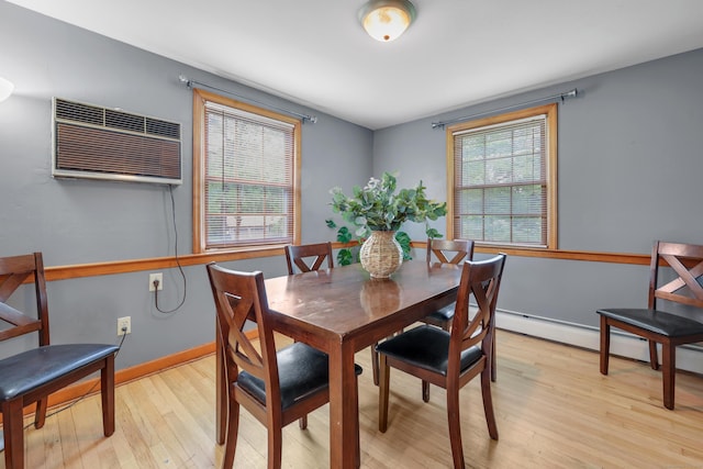 19 Crest Dr, Vernon, CT 06066 - dining area featuring light wood-style flooring, an AC wall unit, a baseboard heating unit, and baseboards