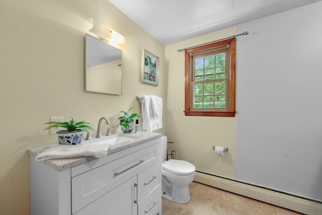 19 Crest Dr, Vernon, CT 06066 - half bath featuring a baseboard radiator, vanity, toilet, and tile patterned flooring