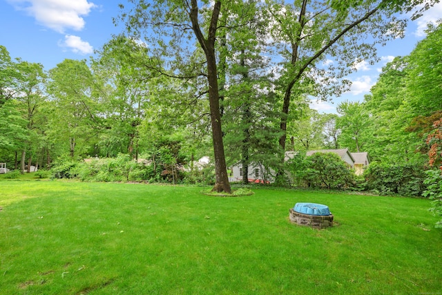 19 Crest Dr, Vernon, CT 06066 - view of green lawn with a fire pit