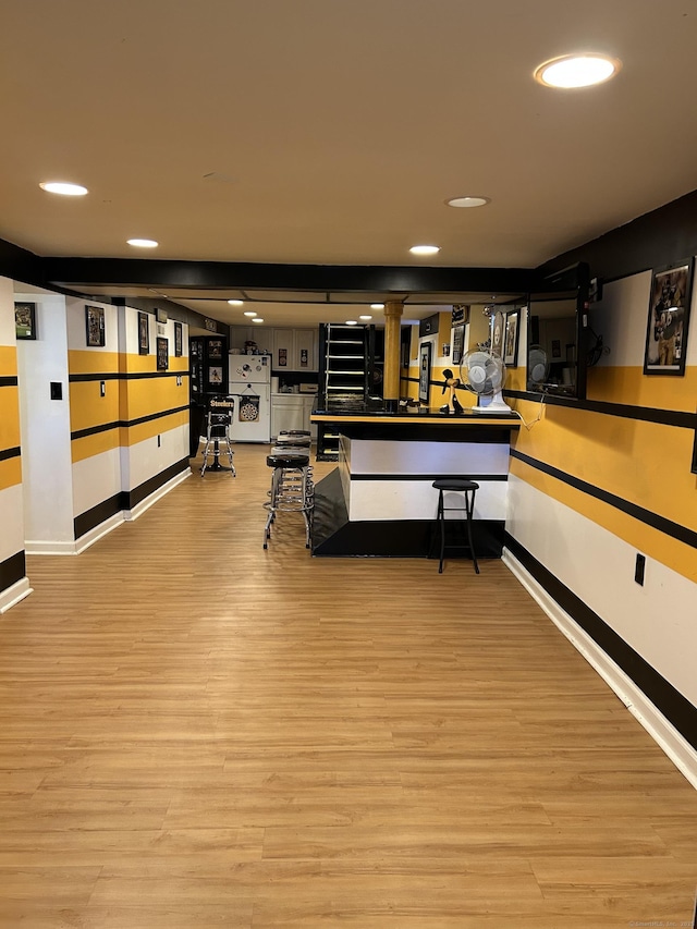 miscellaneous room with baseboards, light wood-style floors, and recessed lighting