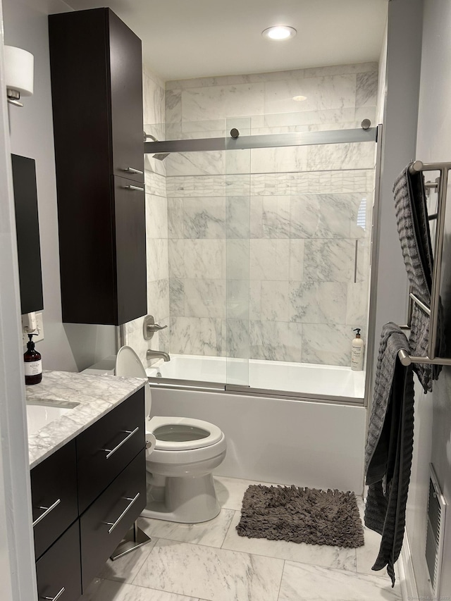 full bath with enclosed tub / shower combo, toilet, vanity, marble look tile flooring, and recessed lighting