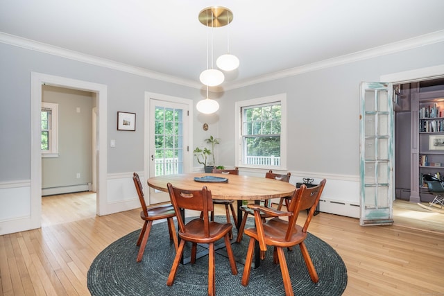 26 Ridgewood Rd, West Hartford, CT 06107 - dining space with a baseboard radiator, ornamental molding, light wood-style flooring, and a wainscoted wall