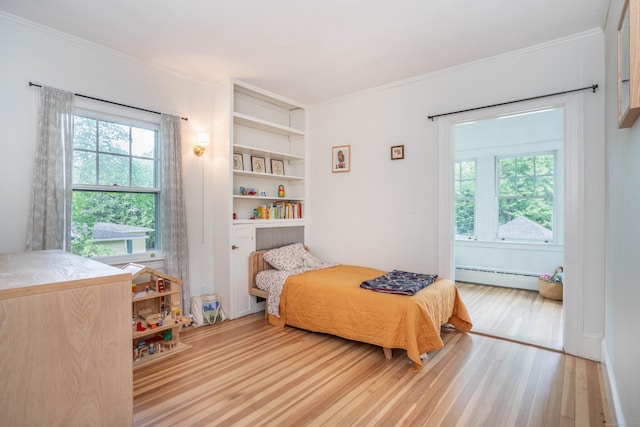 26 Ridgewood Rd, West Hartford, CT 06107 - bedroom with a baseboard heating unit, wood finished floors, and crown molding