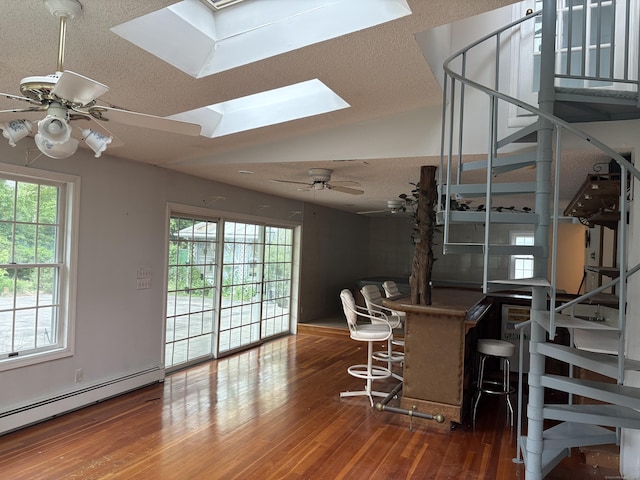 156 Russell Ave, Orange, CT 06477 - dining space featuring a baseboard radiator, wood finished floors, stairs, a ceiling fan, and a textured ceiling