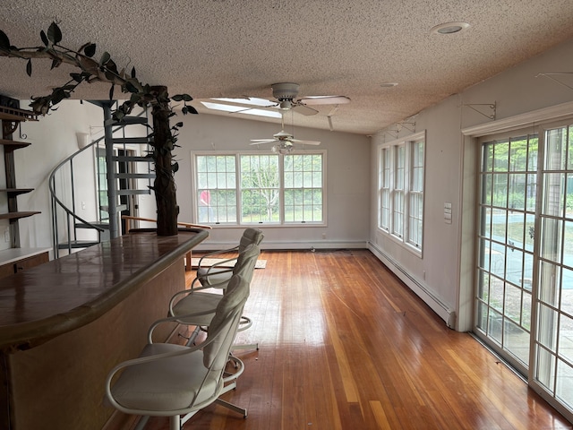 156 Russell Ave, Orange, CT 06477 - unfurnished office with baseboard heating, a textured ceiling, ceiling fan, and light wood-style flooring