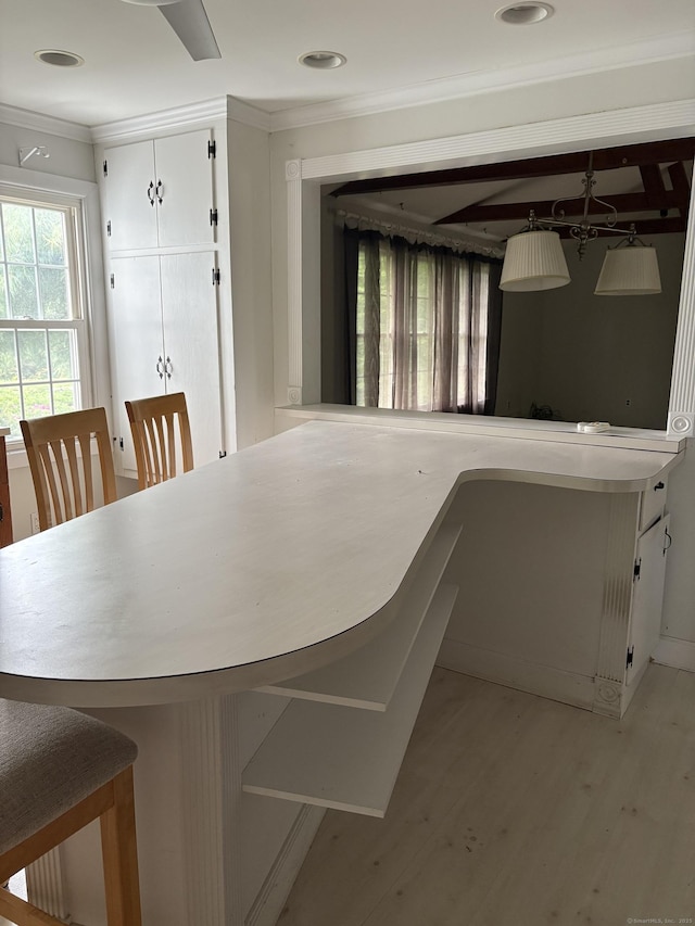 156 Russell Ave, Orange, CT 06477 - unfurnished dining area featuring crown molding, light wood-style flooring, and recessed lighting