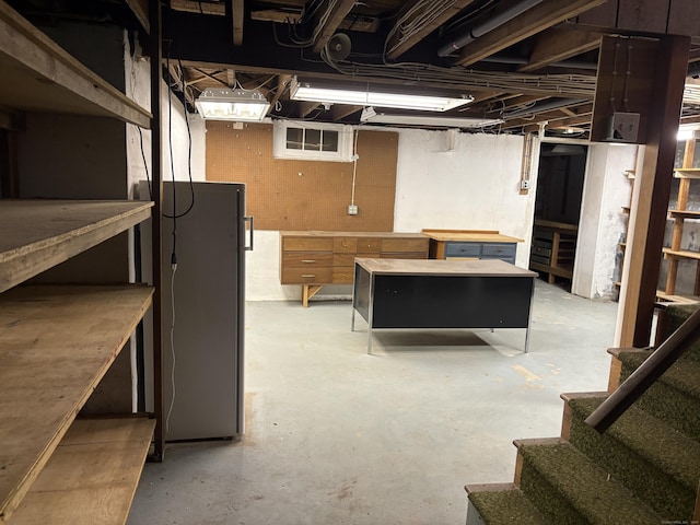 156 Russell Ave, Orange, CT 06477 - unfinished below grade area with stairs and freestanding refrigerator