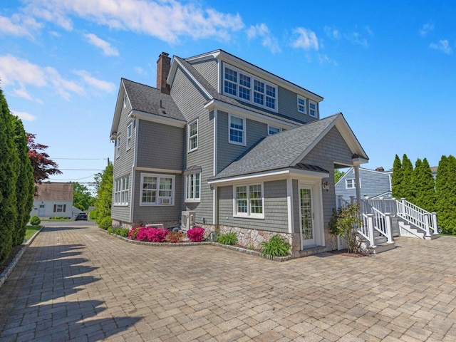 226 Alberta St, Fairfield, CT 06825 - view of front facade featuring a chimney and a shingled roof