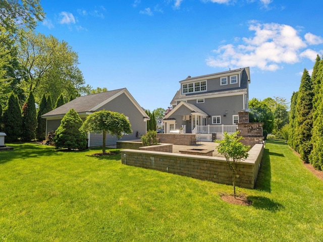 226 Alberta St, Fairfield, CT 06825 - rear view of house with a patio and a yard