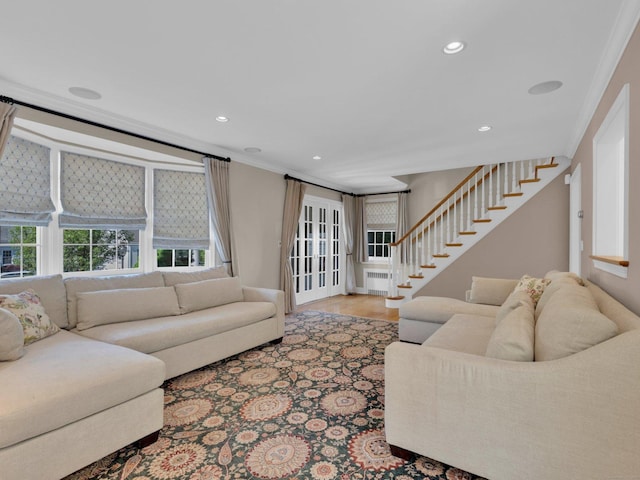 226 Alberta St, Fairfield, CT 06825 - living area featuring radiator heating unit, crown molding, stairs, and recessed lighting