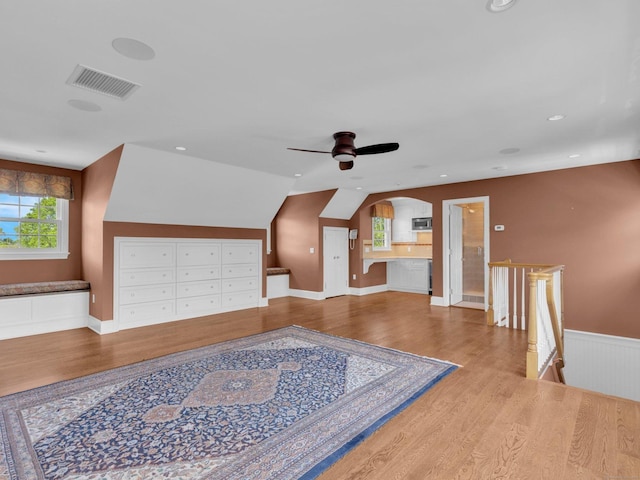 226 Alberta St, Fairfield, CT 06825 - additional living space featuring wood finished floors, ceiling fan, arched walkways, and lofted ceiling